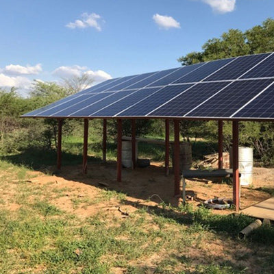 Solar panels in an open field.