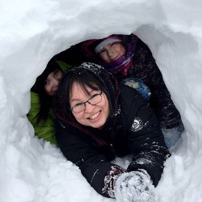 Youth playing in the snow.